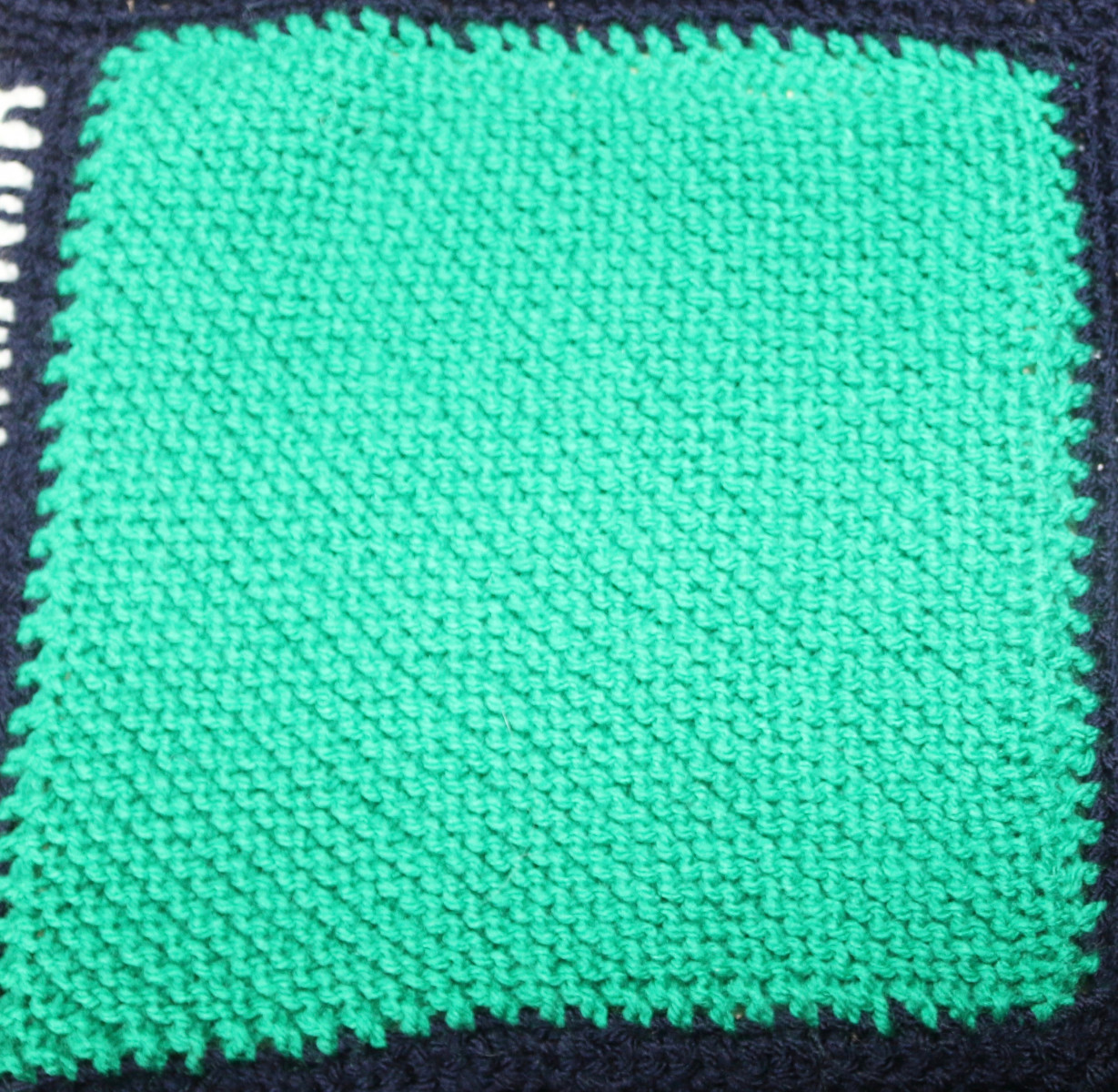Green knitted square