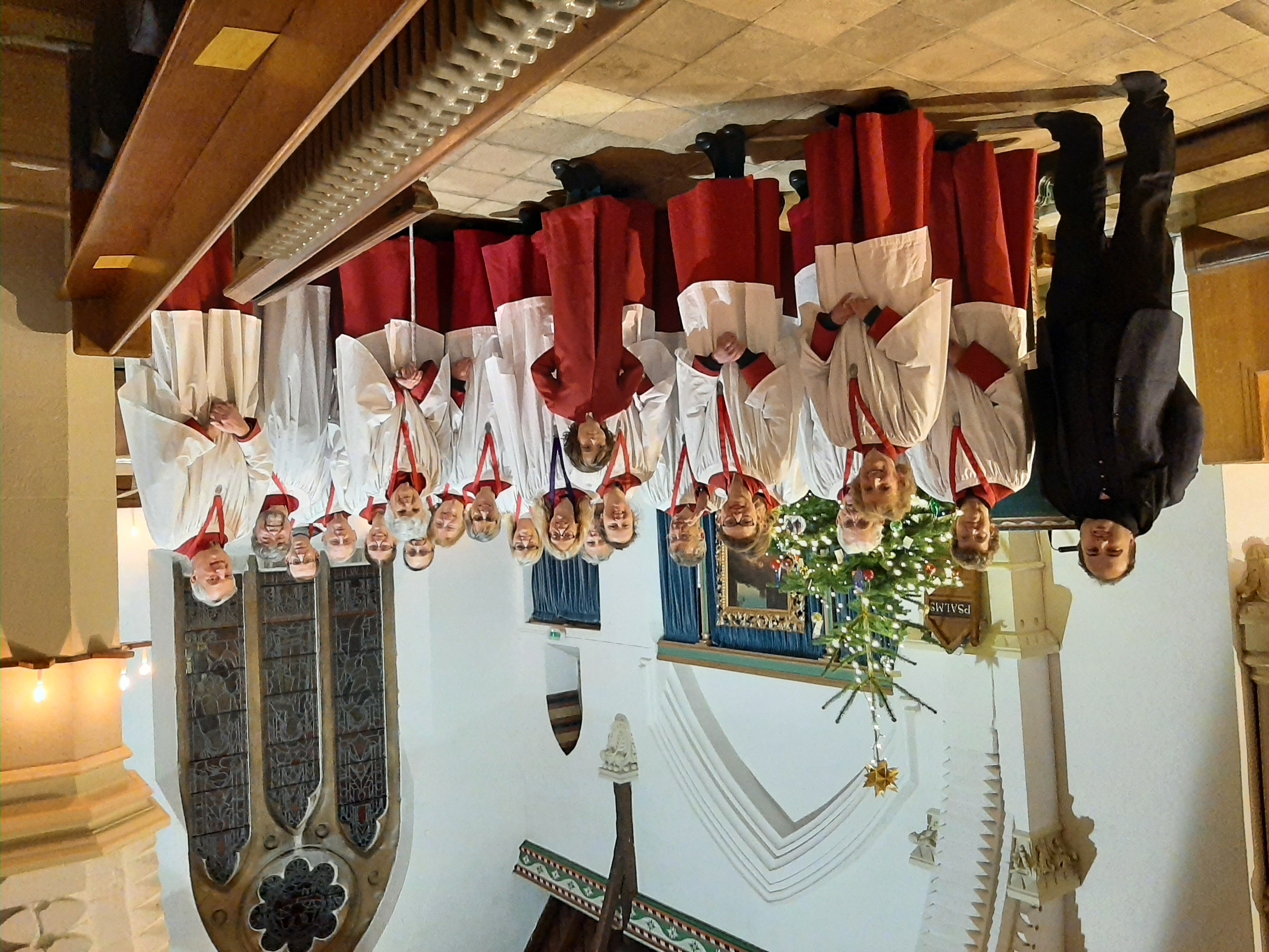 Christ Church Choir members in their red robes and white surplices