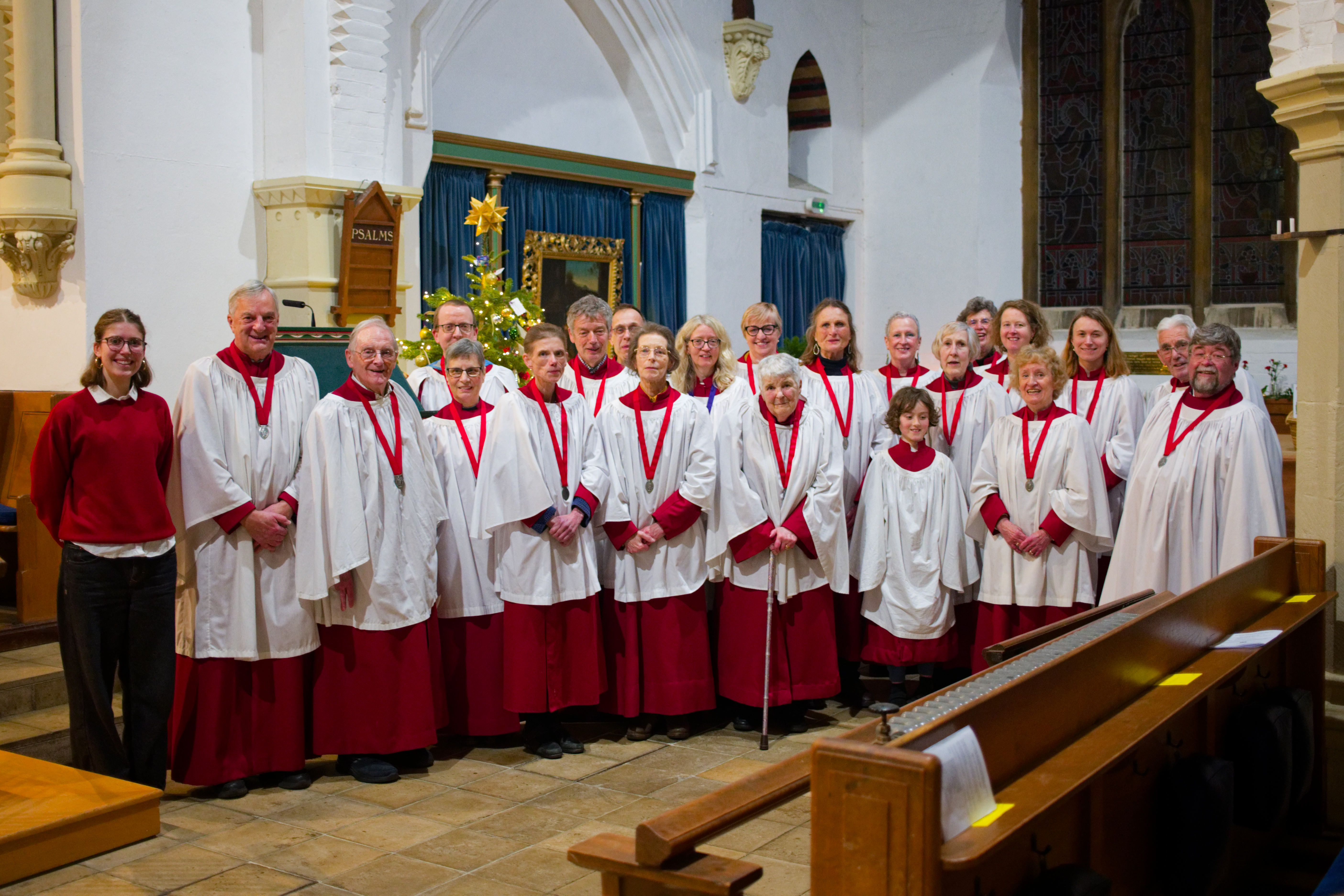 Christ Church Choir members in their red robes and white surplices Christ Church Choir members in their red robes and white surplices