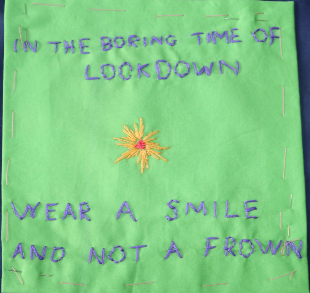 Embroidery saying: In the boring time of lockdown wear a smile and not a frown