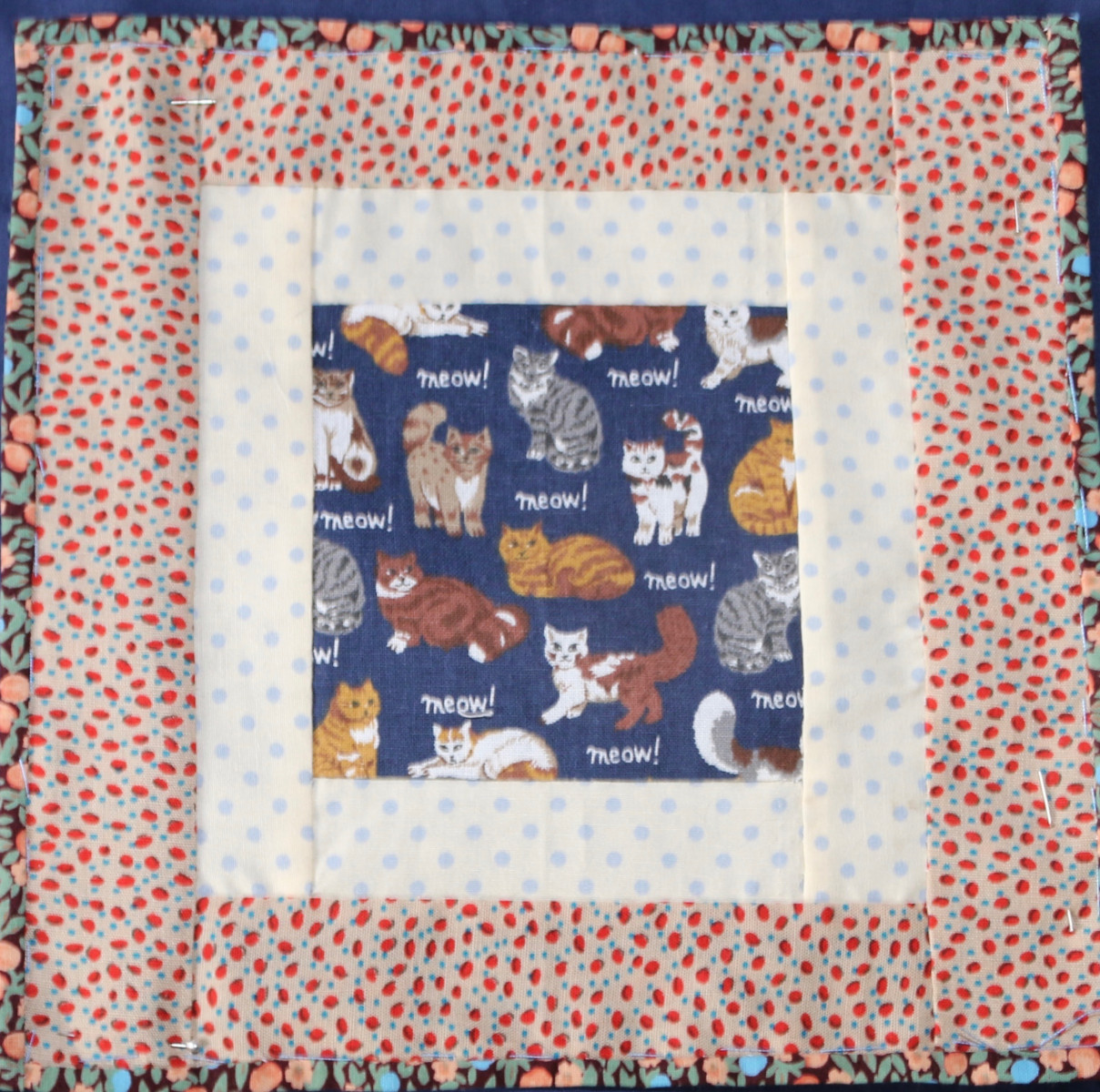 Patchwork square with image of cats