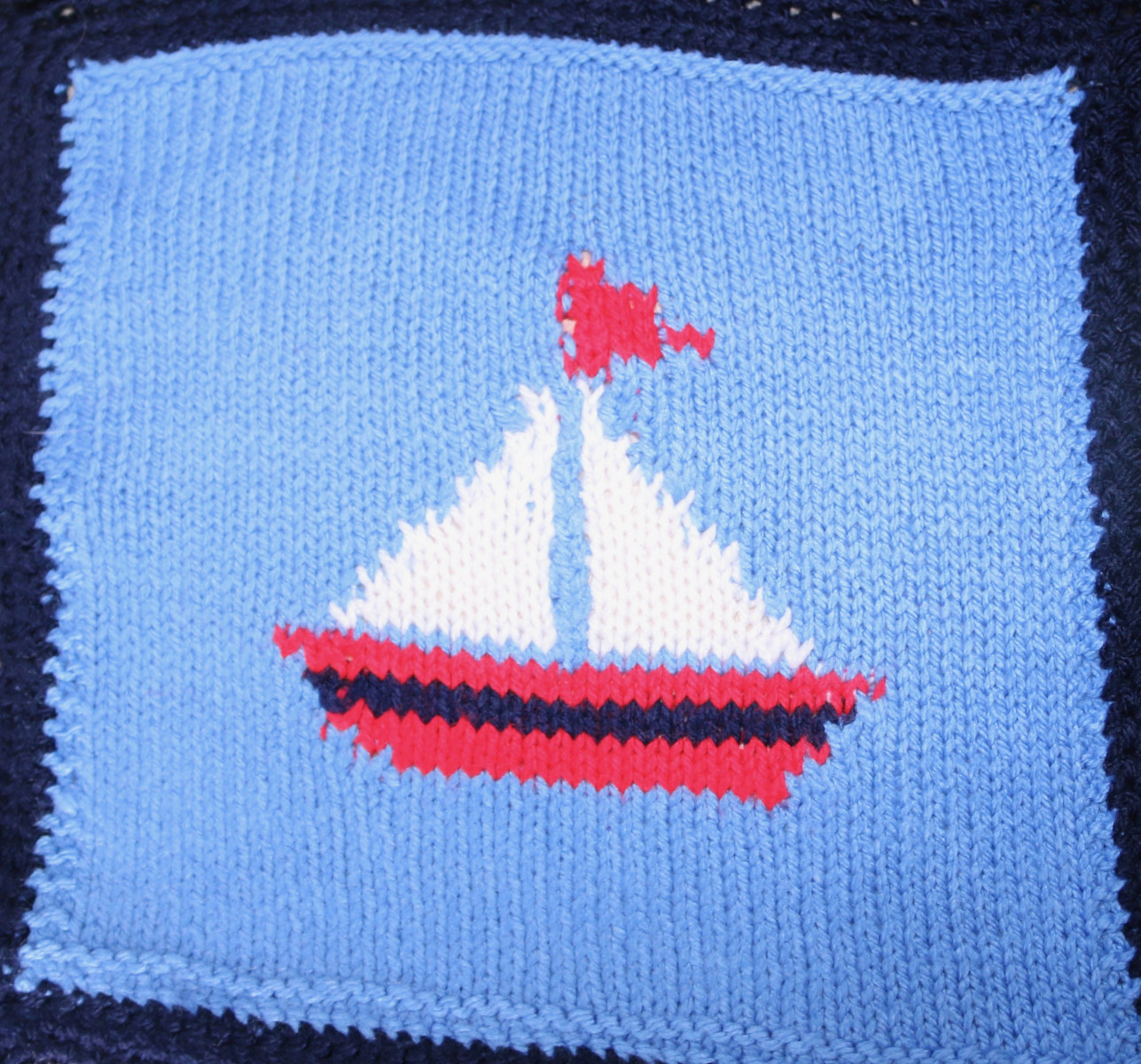 Knitted square of a Sailing Boat