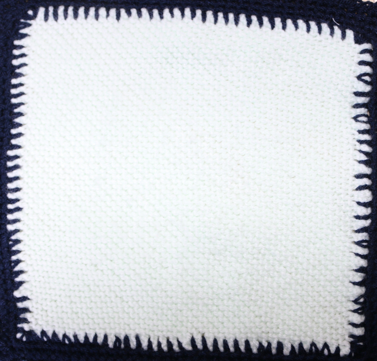 Cream knitted square
