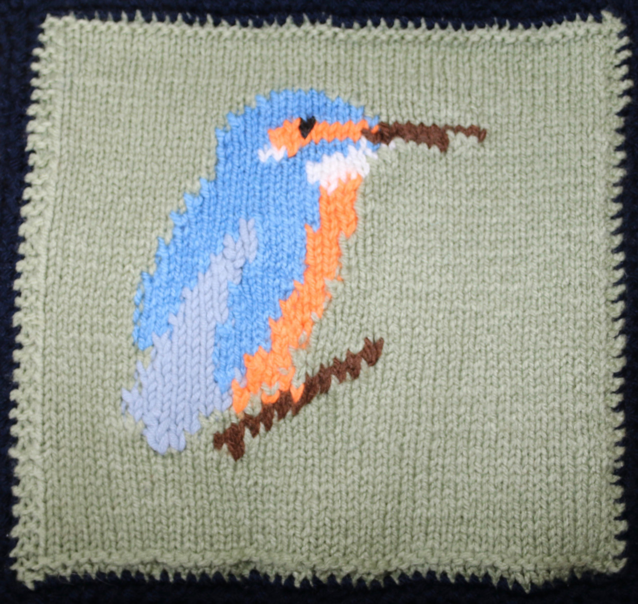 Knitted square of a Kingfisher